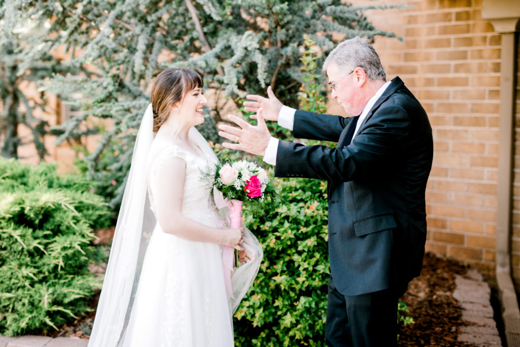 Father seeing his daughter for the first time as a bride - first look